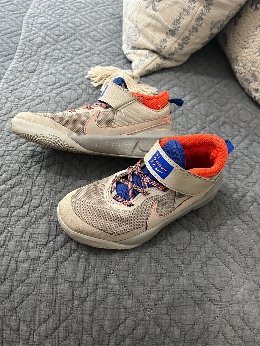 Nike Kids Beige Sneakers with Bright Orange and Blue Accents
